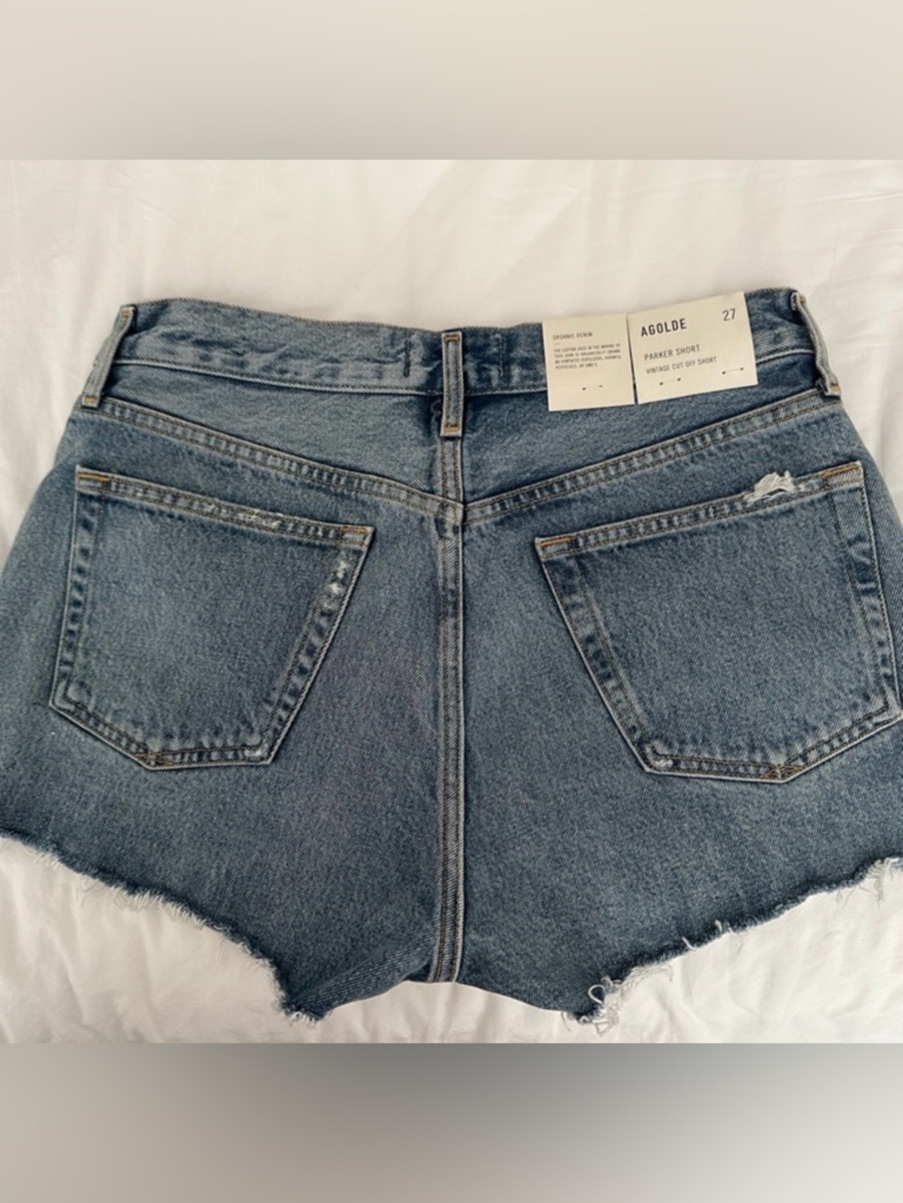 AGOLDE Women's Frayed Hem Denim Shorts Color: Swapmeet. 100% Regenerative Cotton - Picture 2 of 3